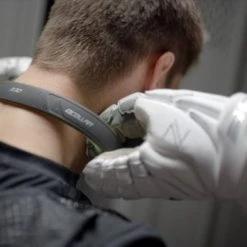 Q-Collar -Lacrosse Unlimited Shop sowers putting on q collar